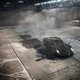 Illustration for article titled Watch This Black Ferrari Enzo Do Gratuitous Donuts In A Warehouse